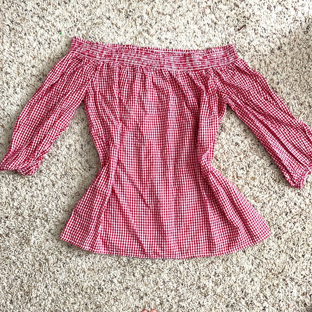 Red/white off the shoulder shirt.